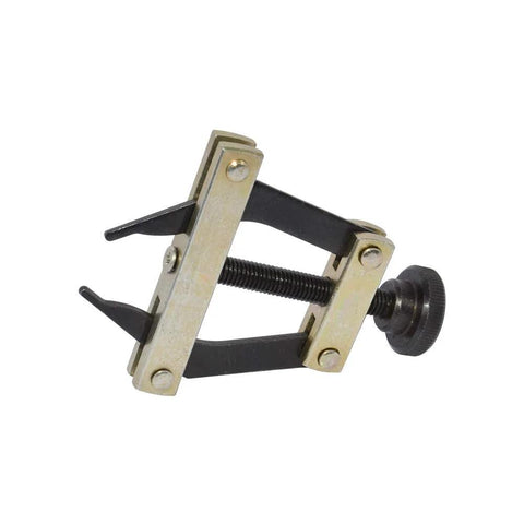 Side view of roller chain connecting puller holder tool with black frame and brass plates.