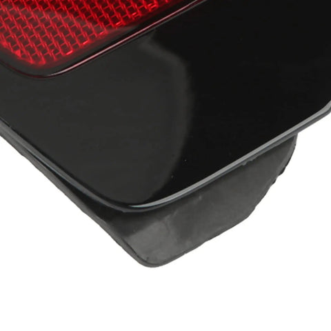 Close-up of Bolt On Replacement Right Side Rear Bumper Reflector Cover With Bold Red Lens For Tesla Model 3 And Model Y 2017 To 2020 Models.