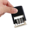 Hand holding the No Sweat Smooth Self Inking Date Roller Stamp With Crisp Adjust Dial, showcasing adjustable date rollers.