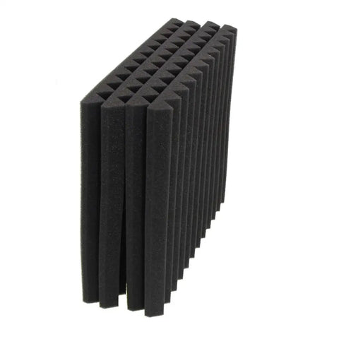 Kickass High Density Soundproof Wall Panels 12 Pack Black Acoustic Foam Wedge Tiles stacked showing beveled edges for noise reduction.