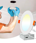 DAYBETTER 6 Inch 5 CCT Led Recessed Ceiling Light with Junction Box installed by a person wearing gloves.
