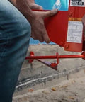 Metaltech Pump Jack Brace 2201, red metal automotive jack accessory, side view installed on a vertical post