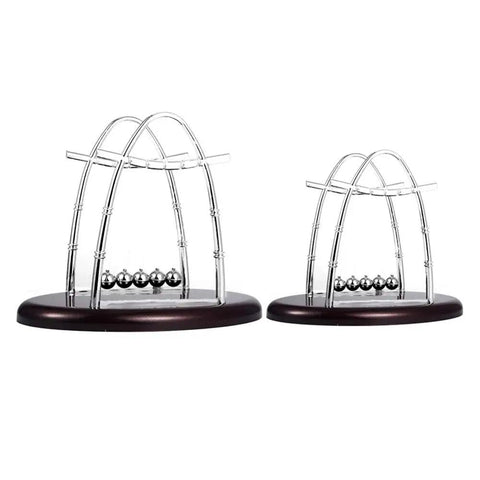 Two Piece Newton's Cradle Desk Toy For Science Nerds with steel balls and plastic frame, demonstrating physics concepts.