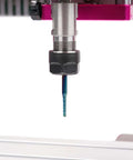 CNC router end mill, blue-coated, in ER16 collet on spindle (close-up).