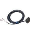 DC 12 24V NPN Infrared Photoelectric Sensor With 100mm Diffuse Reflection Detection For Automatic Equipment And Industrial Automation Applications For Packaging Lines And Conveyors In Manufacturing And Automation. Black sensor with cable
