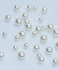 Hookah Bearing Balls Set Mixed Sizes 8mm 10mm 12mm Plastic Shisha Purge Valve Balls Pearls on White Surface