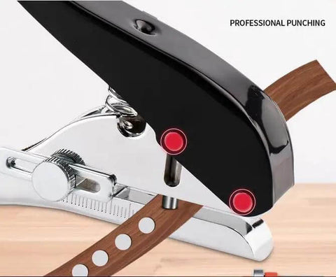 Beast Of A Heavy Duty Single Hole Punch Handheld Paper Punch with ergonomic handle and spring, shown punching holes in brown material.