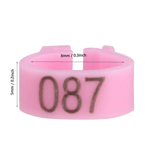 Closeup of pink 8mm bird leg ring numbered 087, part of 100 Pieces Pigeon Leg Bands 8mm Numbered Bird Leg Rings for Small Birds Poultry Foot Clips Clip On Weatherproof Plastic ID Tags for Finch Dove Lovebird Quail Health Tracking and Age Recording