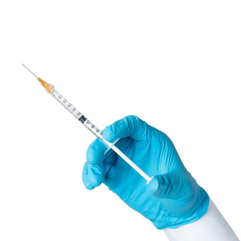 Premium 100 Pack 1Ml Luer Lock Syringes With 25Gauge Needles, Heavy Duty Industrial Disposables in hand with glove.