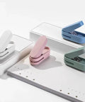 Compact Blue Hole Puncher For 10 Sheets Tiny Single Hole Puncher For Office with colorful options displayed on white background