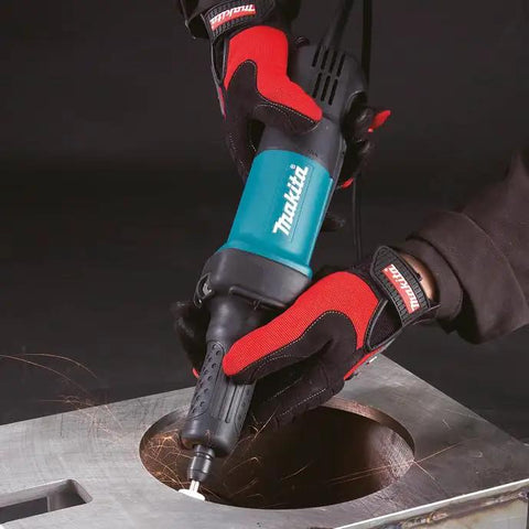 Knockout Performance One Quarter Inch Paddle Switch Die Grinder Slick 3.5 Amp Motor in use on metal surface, showing sparks.