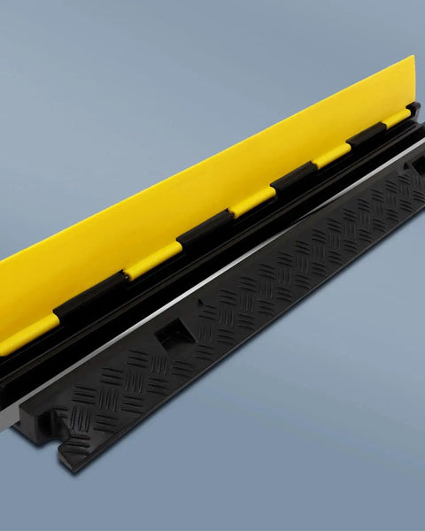 Close-up of Three Pack 2 Channel Cable Protector Ramps BeefedUp Built Tough For 11000 Lbs Per Axle, Yellow and Black design in focus.