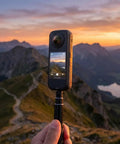 X4 Air 360 Action Camera Bundle With Dual Lens 8K Stabilization Waterproof Lightweight captures scenic mountain view at sunset.