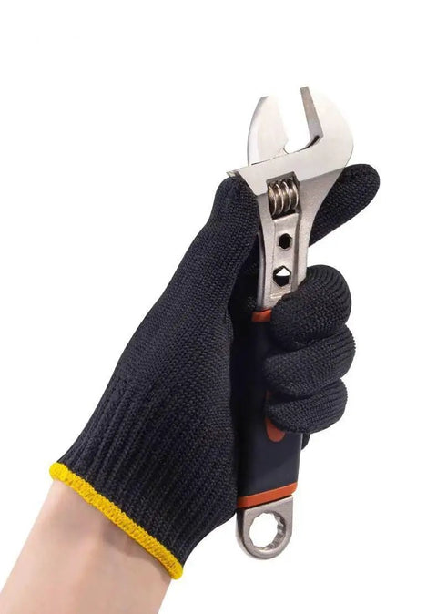 Daily Grind Gear Twelve Pair Pack Of Flexible Polyester Knit Work Gloves Featuring Sturdy Black And Yellow Trim For Light Garage Painting Mechanic Yard Chores And Shop Hustle Tasks, holding an adjustable wrench.