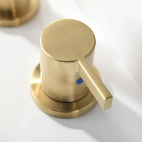 Close-up of brushed gold handle from Two Handles 8 Inch Widespread Bathroom Faucet In Brushed Gold Finish With Valve And Metal Pop Up Drain Three Hole Mount Eight Inch Center Spread Sleek Modern Diy Bathroom Upgrade