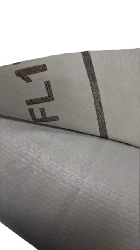 Close-up of Built Tough 95 Gsm Woven Polypropylene Synthetic Roof Underlayment, gray sheet material for roofing.