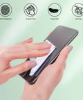 White microfiber eyeglass cleaning cloth (5x6 in) being used to wipe a smartphone screen.
