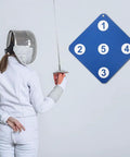 Fencer practicing with Dual Sided Indoor Fencing Target Set With Weather Resistant Rubber Targets For Wall Mount Training