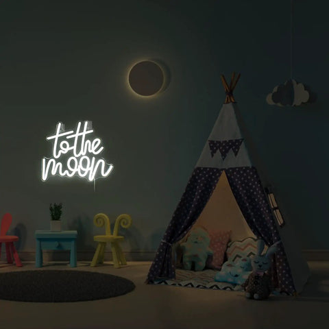 To The Moon Neon Sign LED Letters White Neon Light for wall decor in a children's room with a play tent and toys.