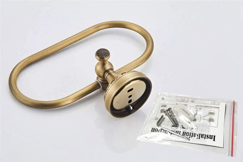 Oval Towel Ring In Brushed Bronze Finish With Antique Brass Look Exquisite Carved Pattern Wall Mounted Hand Towel Holder For Bathroom And Kitchen Heavy Duty Brass Concealed Screws Built To Last Upgrade Your Space displayed on a white surface with installation kit.