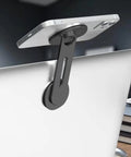 Ultra Thin Aluminum Laptop Phone Holder With Magnetic Quick Mount attached to laptop with phone, silver color.