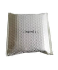 Bubble-wrapped package with 'Lingruiyi' text, containing E26 E27 Light Socket Extender Four Point Five Inch Extension