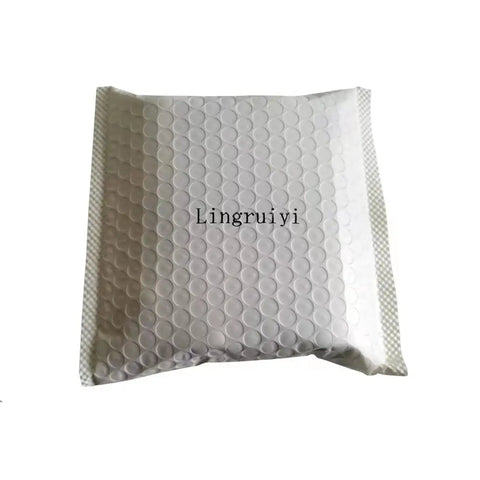 Bubble-wrapped package with 'Lingruiyi' text, containing E26 E27 Light Socket Extender Four Point Five Inch Extension