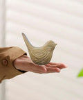 Ceramic Bird Toilet Bolt Covers Decorative Screw Caps Make Installation Easy Peasy While Hiding Ugly Hardware Behind A Slick Shield, hand holding a bird-shaped cover.