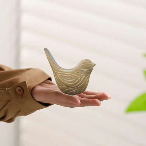 Ceramic Bird Toilet Bolt Covers Decorative Screw Caps Make Installation Easy Peasy While Hiding Ugly Hardware Behind A Slick Shield, hand holding a bird-shaped cover.