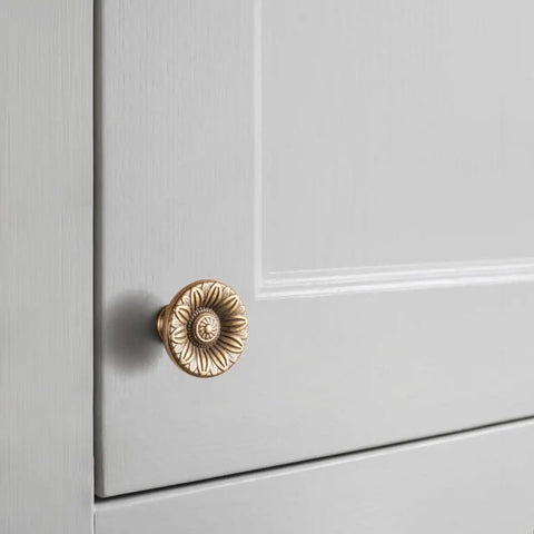 Six Pack Antique Brass Cabinet Knobs With Vintage Floral Drawer Pulls And Sunburst Design on gray cabinet door