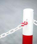 Lightweight White Plastic Safety Chain Links For Crowd Control, 164 Feet Durable Barrier Rope connected to a red post.