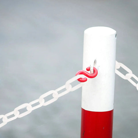 Lightweight White Plastic Safety Chain Links For Crowd Control, 164 Feet Durable Barrier Rope connected to a red post.