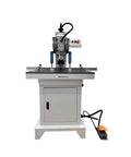 Banfluxion 110V pneumatic hinge drilling machine on a metal stand with control panel and orange foot pedal.