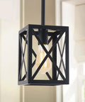 Industrial Pendant Light Fixture With Cross Lantern Shade Black Hanging Chandelier For Farmhouse Kitchen Island And Dining Room Cozy Bar Cafe Hallway Lighting Rustic Barn Lit Vibe showing close-up of black metal frame and bulb.