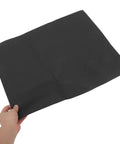10 Piece Floral Embossed Kraft Paper Sheets With Polka Dot Texture For Bouquet Wrapping shown held by hand