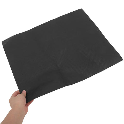 10 Piece Floral Embossed Kraft Paper Sheets With Polka Dot Texture For Bouquet Wrapping shown held by hand