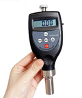 Big League Portable Wood Density Meter Delivering Plus Minus 0.01 G Cm Cubic Precision With No Sweat Calibration And Quick Average Calculation Setup For Lumber Contractors Measuring Heavy Timber On Site in hand.