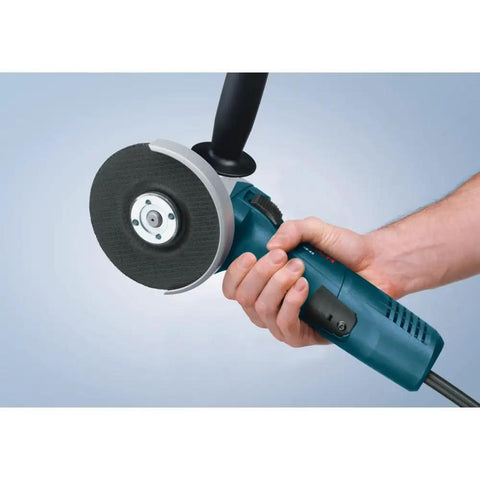 Person holding Powerful 7.5 Amp 11000 RPM Four And One Half Inch Angle Grinder with slim grip and side handle