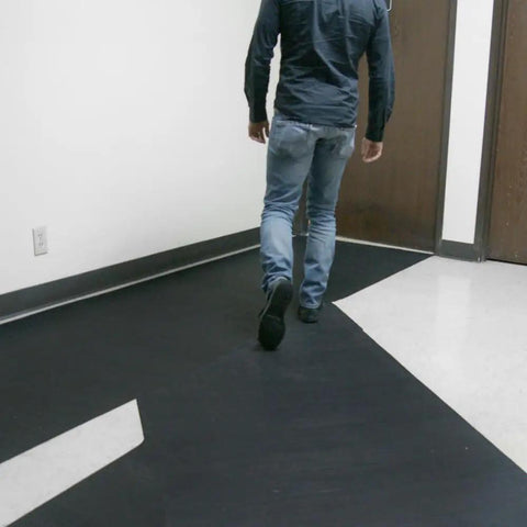 Man walking on Ramp Cleat Non Slip Outdoor Rubber Mat For Entrances And Walkways One Eighth Inch Thick Three Feet By Twenty Feet