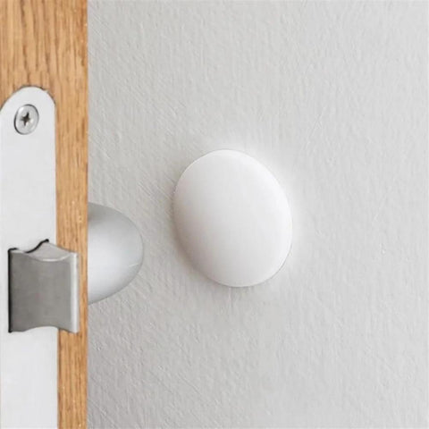 Three Piece Wall Doorstop Set With Self Adhesive Silicone Bumper Pads installed on wall protecting from door impact