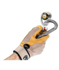 Gloved hand holding Petzl Coeur Pulse 12 Mm Removable Anchor With Locking Function for Secure Concrete Installations.