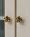 Bougie Antique Brass Flower Cabinet Knobs Vintage Aesthetic Boho Decor Hardware Set of 4 on drawers, five petal design.