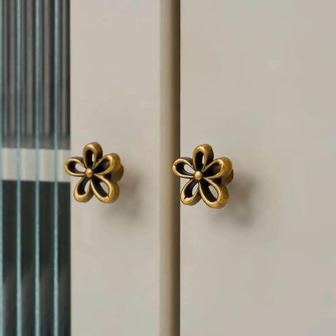 Bougie Antique Brass Flower Cabinet Knobs Vintage Aesthetic Boho Decor Hardware Set of 4 on drawers, five petal design.