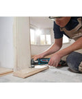 Person using 18V EC Brushless Oscillating Multi Tool With StarlockPlus Quick Change System for flush cut on doorway trim