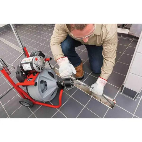 Heavy Duty 115 Volt Electric Conduit Bender Machine Featuring Autofeed And C45 Integral Wound Cable Designed To Bend Rigid Pipe Like Butter in use by a contractor.