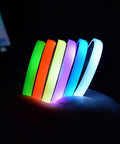 Dope Color Changing Car Cup Holder Lights Kit with USB Charging Mat Waterproof IP67 showing 7 colors in hand at night.