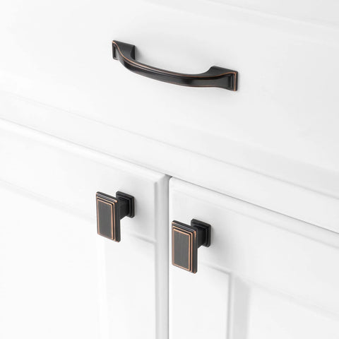 Five Pack 3 Inch Oil Rubbed Bronze Cabinet Pulls installed on white kitchen cabinets.