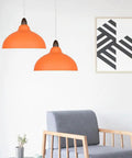 Minimalist Colorful Pendant Light Fixture, Simple Rustic Dome Lamp, Japanese Style Lighting over gray chair in modern setting.