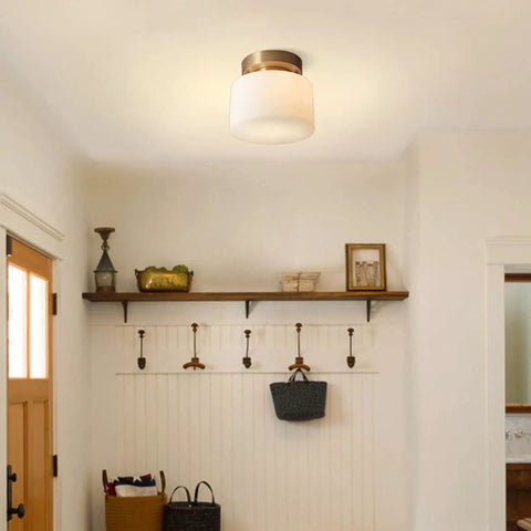 Modern Brushed Gold Semi Flush Drum Ceiling Light Fixture With Milk Glass Shade in a cozy entryway