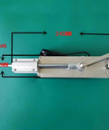 Top view of DIY Electric Reciprocating Linear Actuator Telescopic Motor, 245mm length, M6 rod, aluminum alloy body on green background